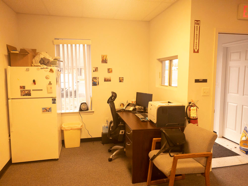 An office room shown with the 511x tint, casting a golden-yellow hue across the space, warming the room’s ambiance while slightly muting the contrast of furniture and decor details.