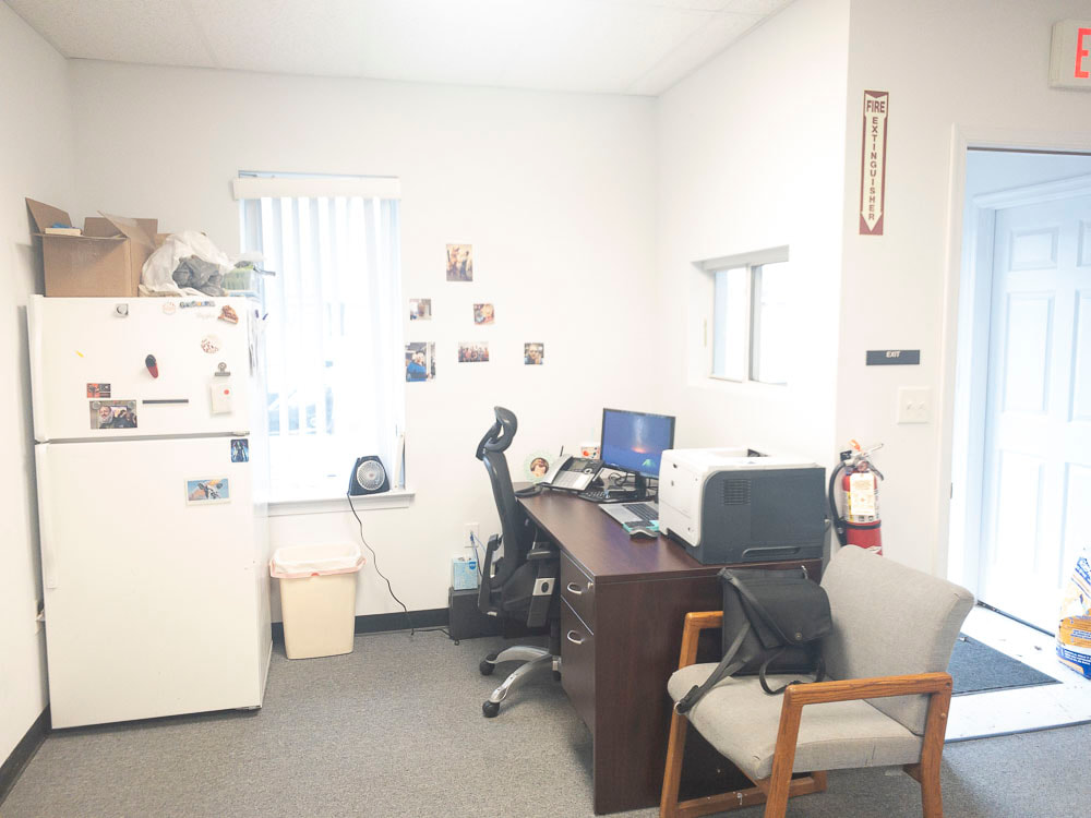 A view of an office room under a light blue tint, applied by the E-15 filter, lightly cooling the room’s tones with a pale blue wash that keeps details clearly visible.