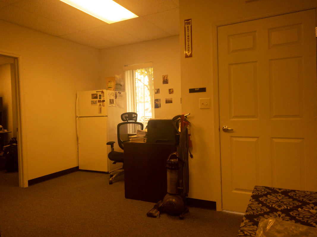 A view of an office room under the Noir 44 filter, featuring a light tan tint that minimally affects brightness and contrast, providing a soft, warm effect across the image.